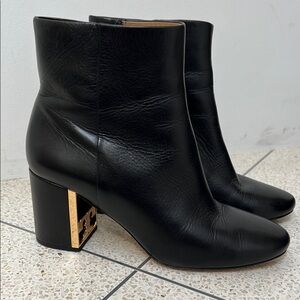 Tory Burch Gigi Black Heeled Boots with Gold Accent